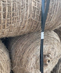 Open Steel Strapping Seals Half Inch By One And A Quarter Inch Galvanized securing large rolls in a warehouse setting