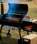 Outdoor smoker grill with ribs cooking, firewood logs for Portable Pizza Oven Firewood Logs for Outdoor Cooking nearby