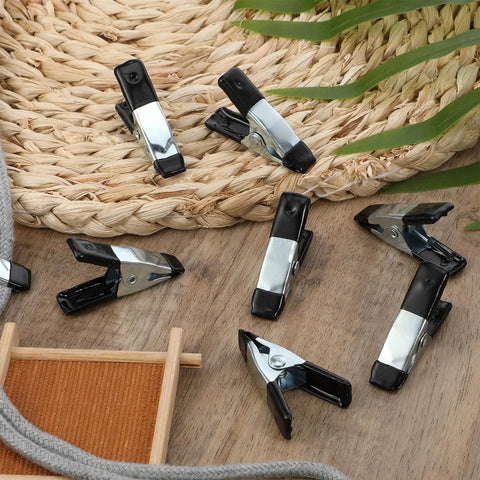 20 Pcs Small Spring Clamps Set Heavy Duty 2 Inch Mini Clips Stainless Steel With Rubber Coated Handle scattered on table