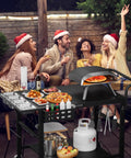 Universal Pizza Oven Table And Grill Cart For Outdoor Kitchens All In One Setup Workhorse Fits Blackstone Ninja Cuisinart Gozney Solo Stove Ovens With Seasoning Tray And Prep Station 47 Inches Long By 27 And A Half Inches Wide By 30 Inches High with people enjoying food outdoors