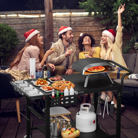 Universal Pizza Oven Table And Grill Cart For Outdoor Kitchens All In One Setup Workhorse Fits Blackstone Ninja Cuisinart Gozney Solo Stove Ovens With Seasoning Tray And Prep Station 47 Inches Long By 27 And A Half Inches Wide By 30 Inches High with people enjoying food outdoors