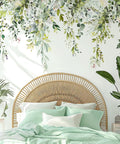Bedroom with green plants wall decals peel and stick large floral leaves over bed, removable vine home decor art.