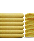 Stack of Premium Microfiber Cleaning Towels 16x16 12 Pack Yellow Reusable, showcasing soft texture and generous size for versatile cleaning.