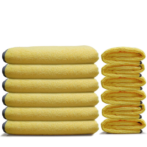 Stack of Premium Microfiber Cleaning Towels 16x16 12 Pack Yellow Reusable, showcasing soft texture and generous size for versatile cleaning.