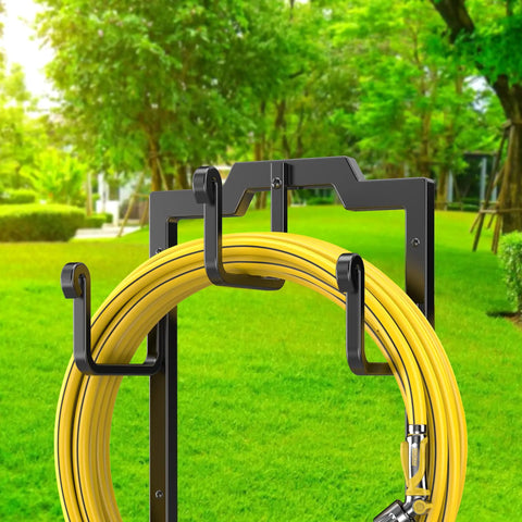 Black Garden Hose Reel Holder With Four Foot Design Modern Metal Water Hose Hanger Organizer Stand For Yard And Patio Keeps Hoses Tidy Easy To Mount Durable And Sleek Storage Solution displaying yellow hose on hooks.