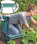 Garden Kneeler And Seat Heavy Duty Portable Folding Bench in use, supporting kneeling woman in garden with soft foam pad and steel frame