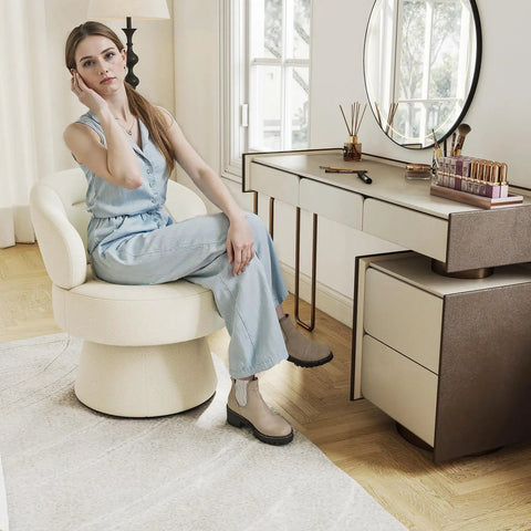 Woman sitting on 360 Degree Swivel Accent Chair in Soft Chenille Boucle Upholstery at vanity, showcasing compact design