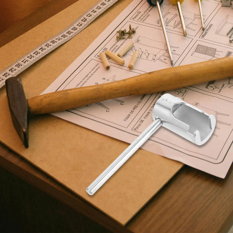 Heavy Duty Universal Fire Sprinkler Wrench Tool Rock Solid Metal Spanner on a workbench with a hammer and tools.