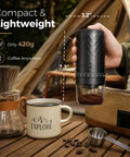 Portable Electric Burr Coffee Grinder Built To Last With Slick Steel Burrs Rechargeable 1800 MAH Battery Drops In Forty Settings Straight Fire Grinds, shown in hand with coffee mug and beans.