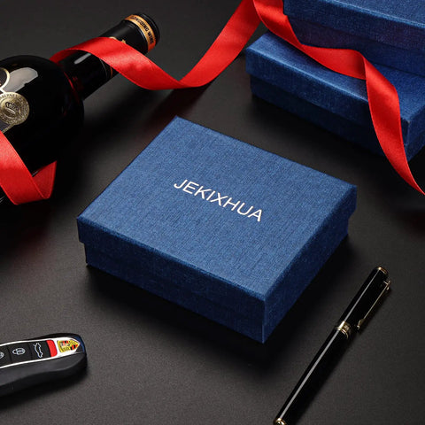 Blue gift box with JEKIXHUA branding, luxury pen, wine bottle with red ribbon, and car key on black surface