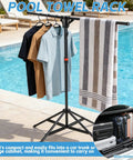 Outdoor Pool Towel Rack, Freestanding 42 to 71 Inch Adjustable Stand with towels, shirts by poolside, close-up of arms.