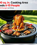 Kickass 22 Inch Steel Kamado Charcoal Grill And Egg Smoker With Cart Featuring Double Wall Insulation And Porcelain Firebox cooking chicken and vegetables.