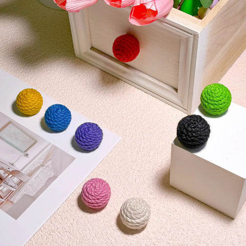 Colorful jute rope knobs arranged on a surface, featuring 6 Pack Jute Rope Cabinet Knobs Set 1.26 Inch Round Wood Knobs For Kitchen Cabinets