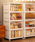 Four Tier Stackable Plastic Storage Bins With Lids, 27.5 Qt Per Bin, 110 Qt Total Capacity, shown in a living room setting.