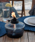 6.25 Inch Adjustable Flame Penta Glass Votive Tabletop Torch For Cozy Patio Vibes Watercolor Blue Outdoor Lighting Twist To Lower Or Raise Flame Long Lasting Burn Time Ideal For Garden Parties on a table