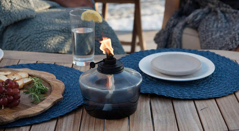 6.25 Inch Adjustable Flame Penta Glass Votive Tabletop Torch For Cozy Patio Vibes Watercolor Blue Outdoor Lighting Twist To Lower Or Raise Flame Long Lasting Burn Time Ideal For Garden Parties on a table