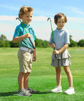 Junior golfers practicing with clubs in a field, showcasing the Junior Golf Club Set For Ages 3 To 5 Left Handed Beginner Starter Kit.