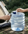 Filling flask using 10L Collapsible Water Container With Spigot For Camping And Hiking, near tent