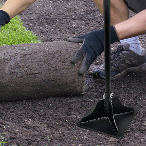 48 Inch Steel Tamper With Long Handle 8 By 8 Inch Garden Yard Tamper leveling soil next to rolled grass sod