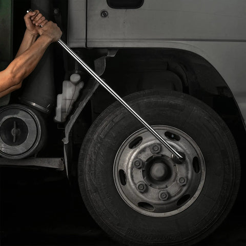 Person using Three Quarter Inch Drive Breaker Bar 40 Inch Length CRV Steel Heavy Duty Tool For Loosening Stubborn Lug Nuts