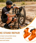 Cyclist using Two Pack Bike Repair Stands with Handlebar Support for Quick Bike Maintenance in muddy terrain.