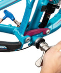 Using Bottom Bracket Bearing Press Set with Quick Release for fast installation on bike, includes machined bushings for 68mm to 150mm widths.