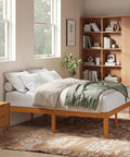 Built Tough Queen Size Platform Bed Frame In Real Natural Pine Wood With Thick Wooden Slats For Zero Wobble Support Never Requires A Box Spring And Flawless Setup For Your Bedroom Space in a warm, modern bedroom.