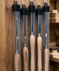 Dead On Precision Cryo Treated M2 High Speed Steel Bead Forming Chisel For Wood Lathe Pros To Crush Perfect Uniform Beads Quick And Flawless No Sweat On Any Project hanging in storage rack