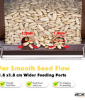 Weatherproof Metal Wall Mounted Bird Feeder With Heavy Duty Roof And Detachable Easy Clean System Screwed In Mounting For Outdoors Perfect For Trees Fences Or Walls 1.3 Lb Capacity Durable Outdoor Bird Feeder showing wider feeding ports with sunflower seeds.
