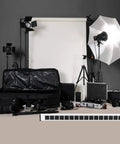 Beefy 16 Outlet Heavy Duty Power Strip With 15 Foot Extension Cord Metal Build Circuit Breaker Mounting Brackets Included Industrial Workshop Grade ETL Certified Black in photo studio setup with lighting equipment.
