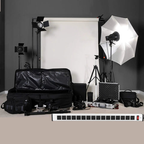 Beefy 16 Outlet Heavy Duty Power Strip With 15 Foot Extension Cord Metal Build Circuit Breaker Mounting Brackets Included Industrial Workshop Grade ETL Certified Black in photo studio setup with lighting equipment.