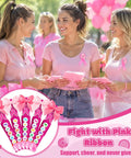 Three women in pink shirts with ribbon pins at a Breast Cancer Awareness Duck Cheer Pins Kit for Volleyball Squad and Team Spirit Crafting Includes 60 Rose Red Wooden Clothespins 60 Rose Red Mini Ducks 60 Pink Ribbon Charms 60 Ribbon Bows Five Bags of Letter Beads Fight and a Glue Tube.