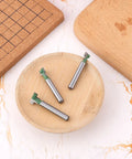 3 Piece Keyhole Router Bits With One Quarter Inch Shank For T Slot Cutting And Hex Bolt Mounting on a wooden plate.