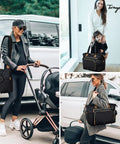 Stylish mom carrying large waterproof diaper tote bag for hospital labor delivery with pacifier case and changing pad in black.