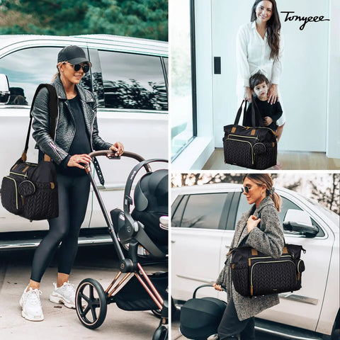 Stylish mom carrying large waterproof diaper tote bag for hospital labor delivery with pacifier case and changing pad in black.
