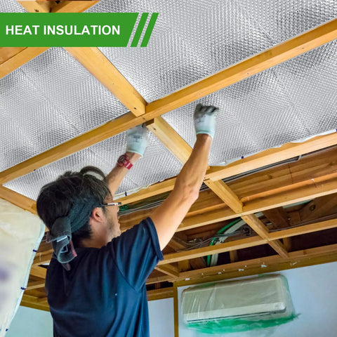 Man installing Heavy Duty Aluminum Radiant Barrier Insulation Roll 24 By 50 Feet in attic rafters for heat blocking.
