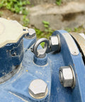Close-up of installed 4 Pack 316 Stainless Steel One Quarter Inch UNC Eye Bolts With Shoulder Lifting Rings on blue machinery