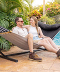 Double Portable Hammock with Stand for Two People, Curved Spreader Bar, Balance Ropes Included, Dark Gray by poolside outdoors