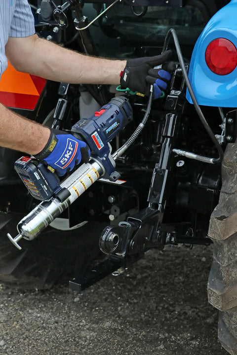 Using PowerLuber 20V Cordless Grease Gun with 36 Inch Hose, high output 10000 PSI for industrial tractor maintenance