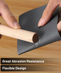Hands demonstrating flexibility of 18 Piece Wet Dry Sandpaper Kit 120 To 3000 Grit For Metal Wood Automotive And Furniture