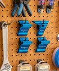 Nail Perfect Joints With This Straight Shooting Dovetail Saddle Square And 1 8 Angle Marking Tool For Hardwoods Solid Aluminum Build Easy Grip Woodshop Must Have Gear, blue aluminum layout tools on pegboard.
