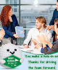 Smiling team applauding with Crochet Golf Ball Accessories Gift Set For Men displaying 'Best Human By Par' award.