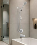 Evolve ShowerStart Express Multifunction 1.5 GPM Handheld Shower with Hot Water Saver Thermostatic Valve and Auto-Diverting Tub Spout System, Chrome against sleek bathroom tiles.