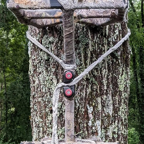 Four Pack Cam Cleats For Marine Gear Rock Solid Aluminum Rope Locks installed on a tree, securing ropes for sailboats and canoes.