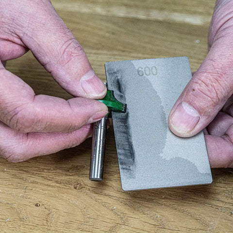 Using All In One Credit Card Diamond Sharpening Kit With 180 300 Grit And 600 1000 Grit Stones on a tool edge for precision sharpening.