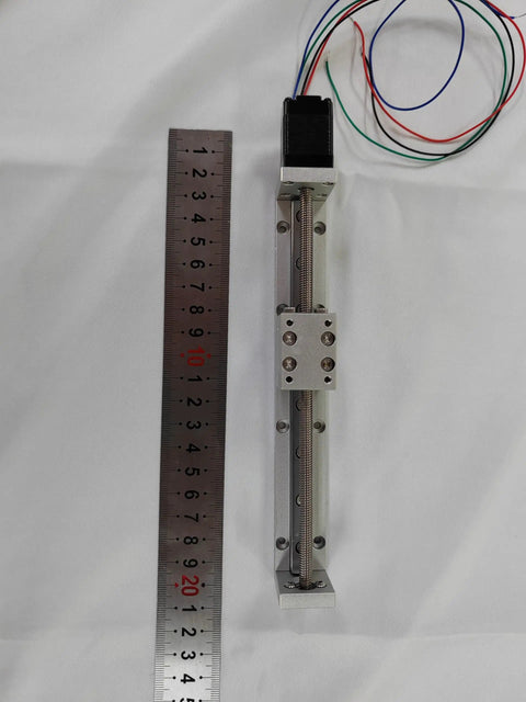 Compact Linear Motion Actuator With Lead Screw And Built In Motor next to ruler for CNC router X Y Z axis travel 120mm