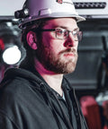 Worker wearing Vantage II 350 Lumen Hands Free Helmet Light With Rear Safety LED For Fire Service Industrial Job Site Use Helmet Mounted Illumination Delivers Bright Close Range Visibility in dim surroundings