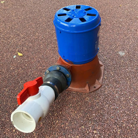Micro Hydroelectric Generator 1500W 220V Water Turbine with copper core coil, thick cast iron shell on red gravel surface