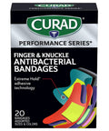 The Real Deal Fingertip And Knuckle Bandages With Extreme Hold Adhesive, Durable Fabric Antibacterial Wound Dressings For Cuts And Scrapes, outer packaging showing assorted colors and sizes.