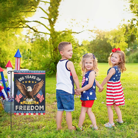 Patriotic Eagle Garden Flag For Outside Celebrating 250 Years Of Freedom 1776 To 2026 in yard with children in USA-themed outfits.